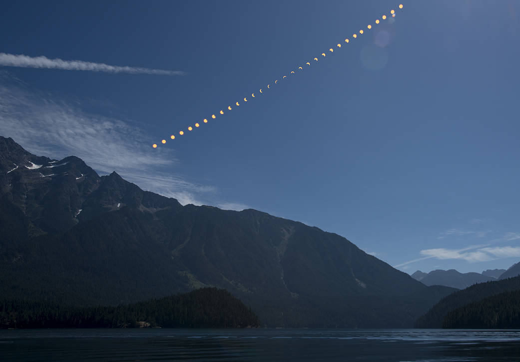Composite solar eclipse image over Ross Lake Credit: B. Ingalls