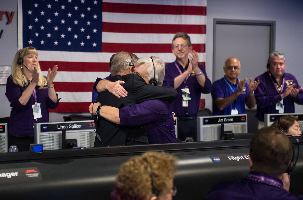 Cassini managers embrace at mission control