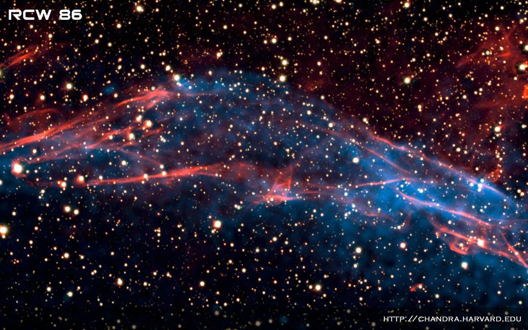 Blue and red cloud of gas and dust with stars scattered around against deep space