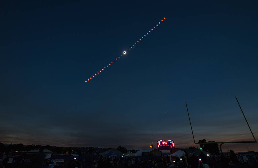 This composite image shows the progression of a total solar eclipse over Madras, Oregon 