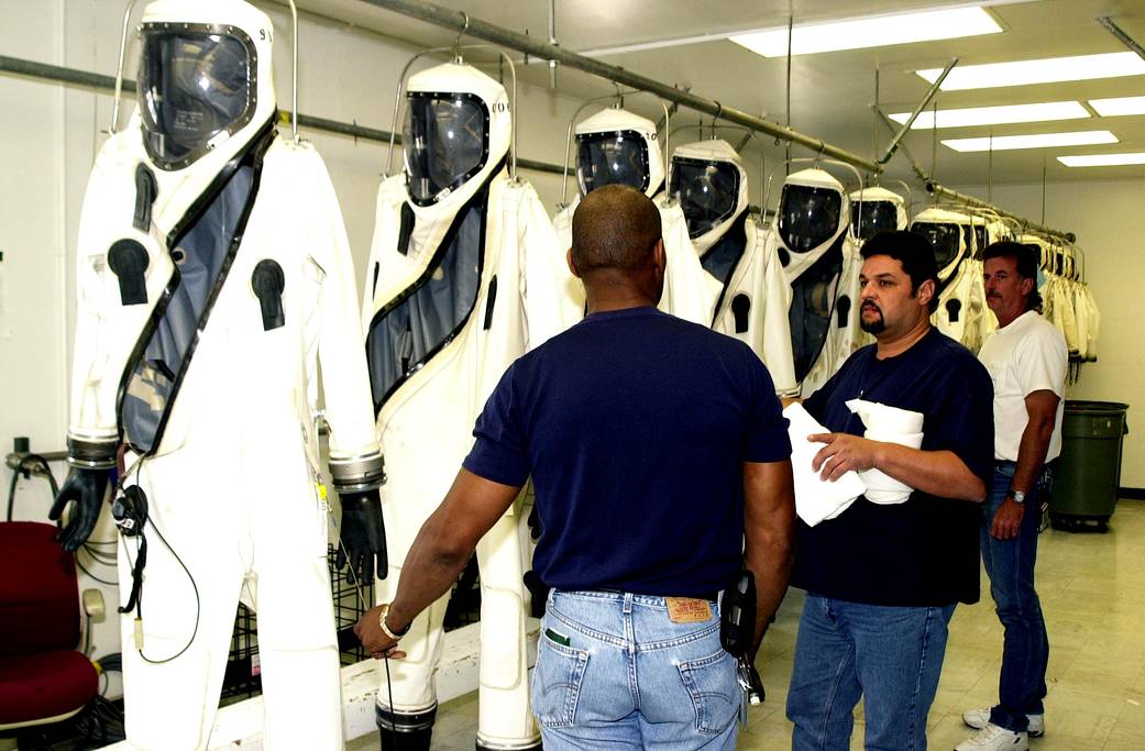 SCAPE suits are ready for workers who will use them during fueling of the Comet Nucleus Tour (CONTOUR) spacecraft.