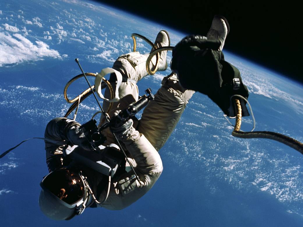 Astronaut Ed White floating in space outside Gemini spacecraft