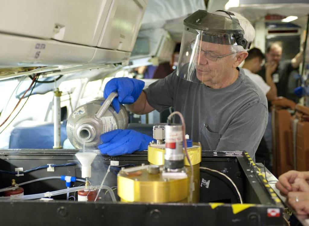 Researcher Maintaining Differential Absorption CO Measurement Instrument