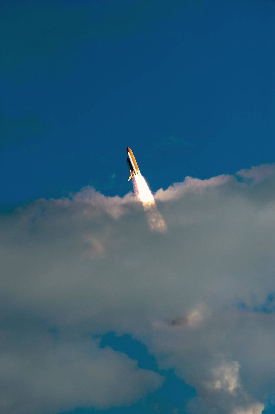 Atlantis Breaks Through the Clouds