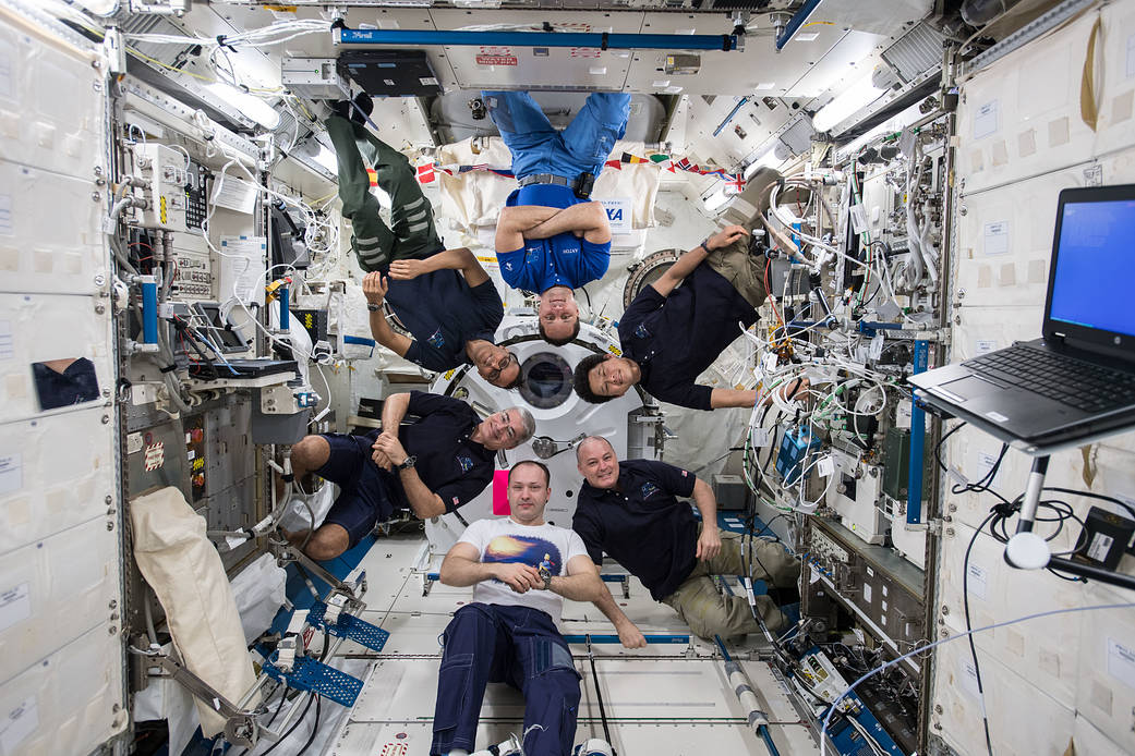 Six Expedition 54 crew on space station pose for group photo