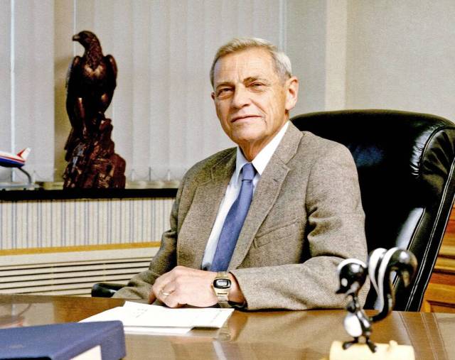 Former Center Director Martin Knutson sitting at a desk.