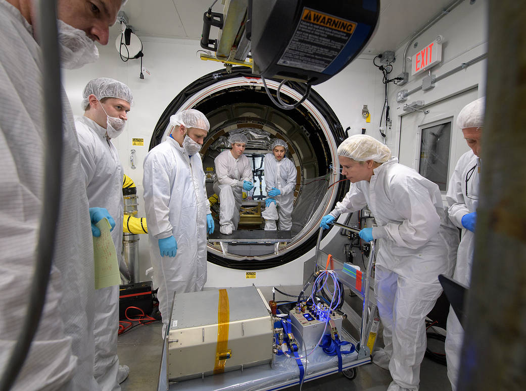 Mission engineers load the final cargo into the Cygnus resupply spacecraft