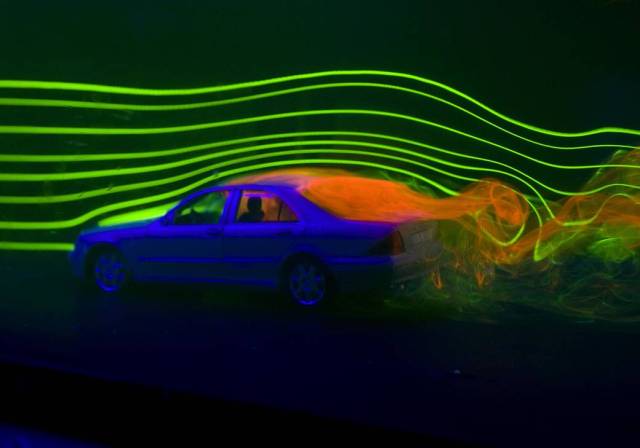model car in water chamber with laser around model car