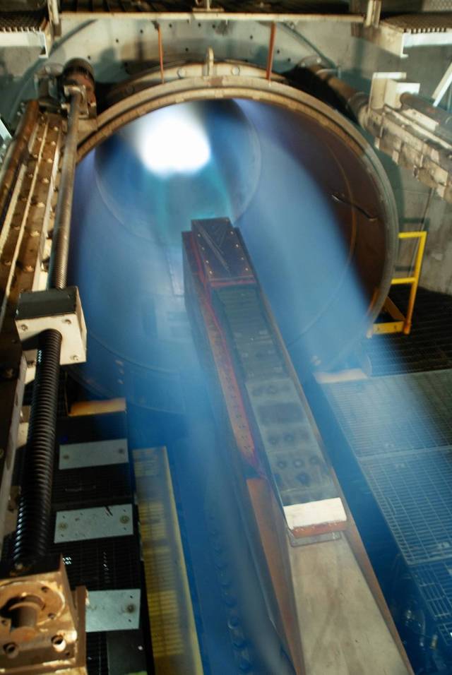 Rays of light shining through circular tunnel entrance