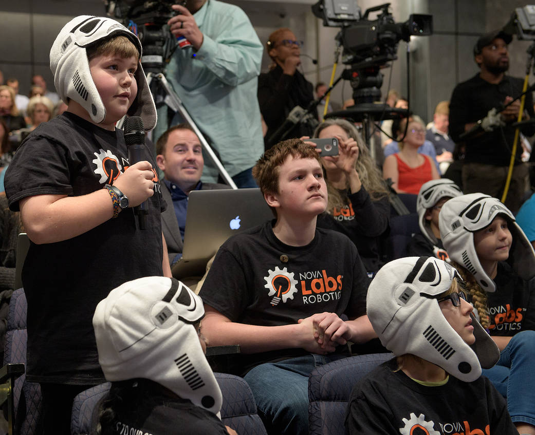 A Nova Labs Robotics "BrainStorm Troopers" team member asks a question during an Commercial Lunar Payload announcement