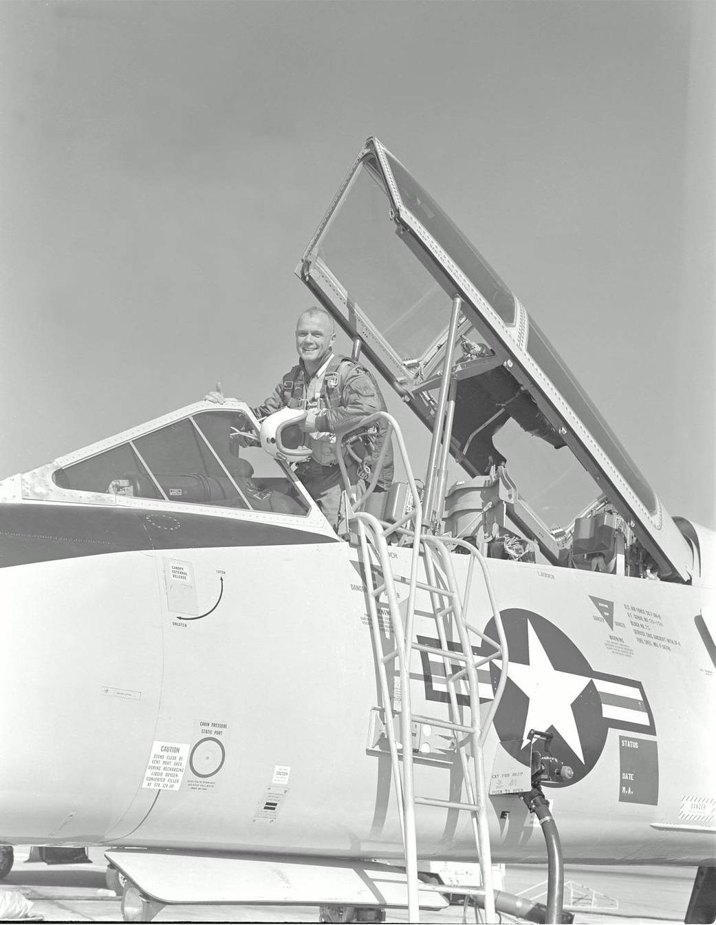 Glenn in a training aircraft