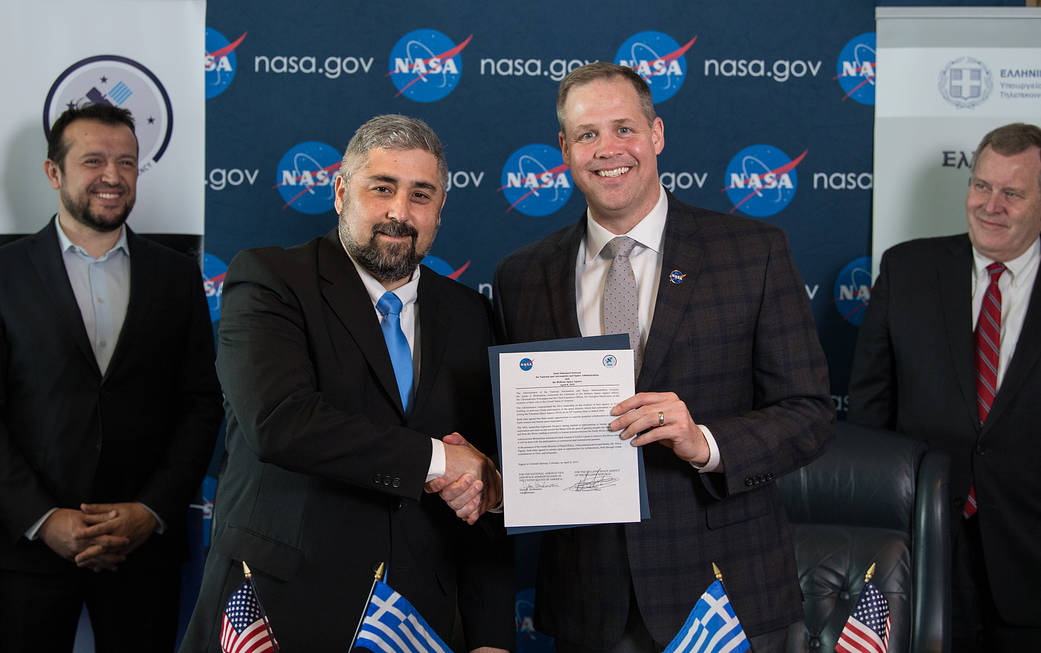 NASA Administrator shakes hands with Hellenic Space Agency CEO