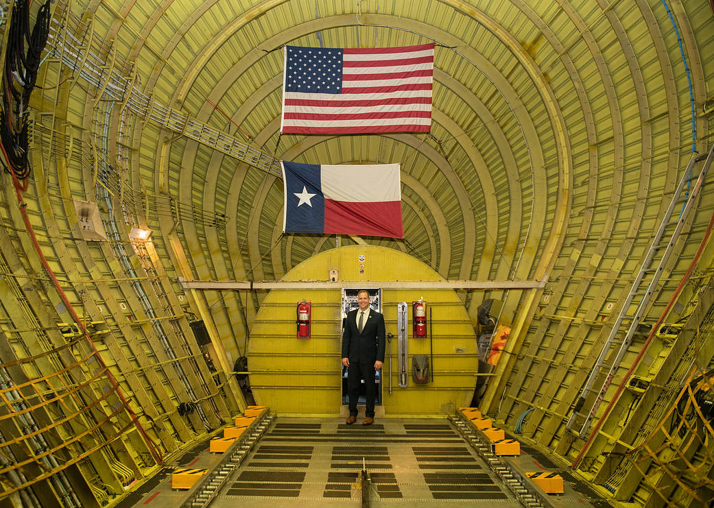 NASA Administrator Jim Bridenstine poses for a photo inside the super guppy