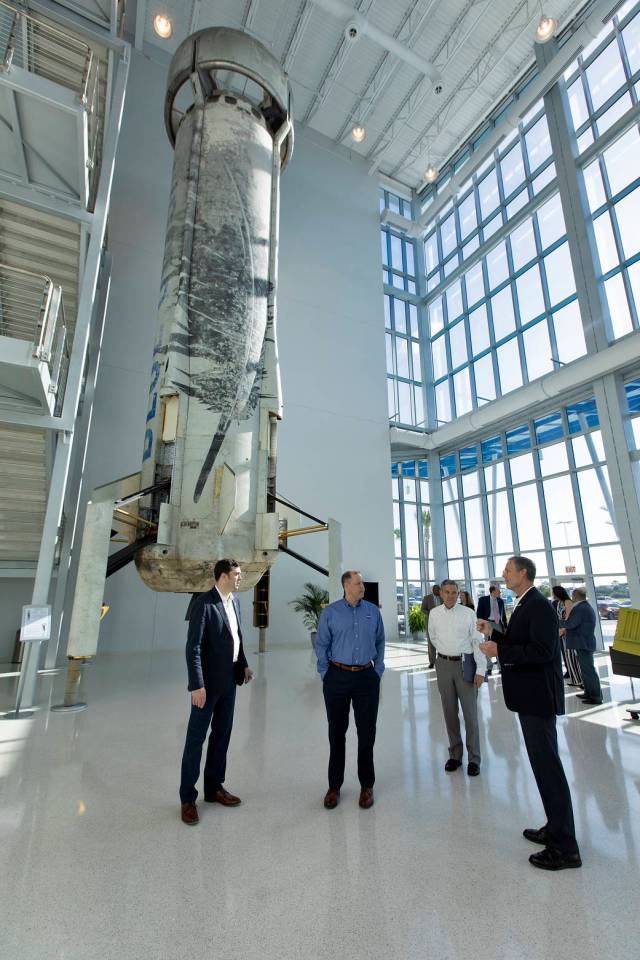 NASA Administrator and officials at Blue Origin facility