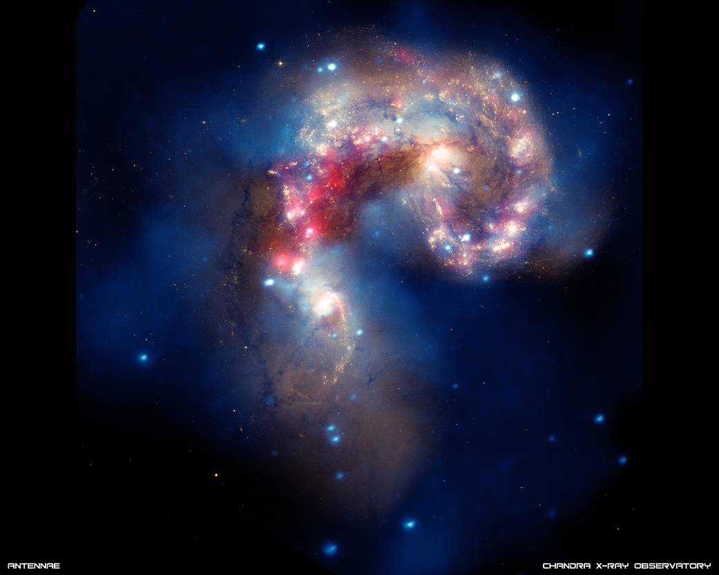 Comma shaped curved cloud of gases in bright white with rose at center against deep space