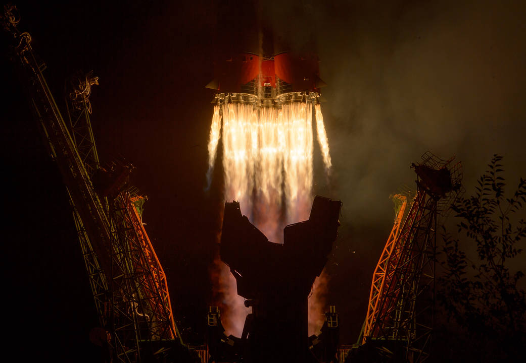 Closeup of Soyuz rocket engines igniting as the rocket leaves the pad.