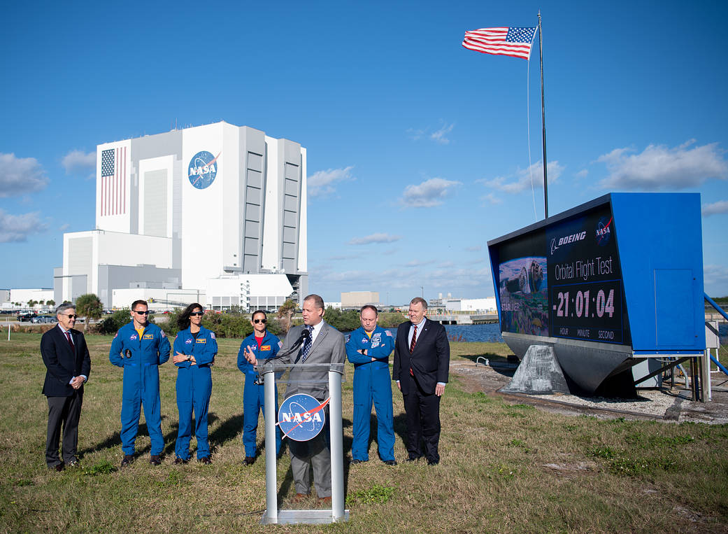 Administrator, Kennedy Space Center director and astronauts at Kennedy countdown clock