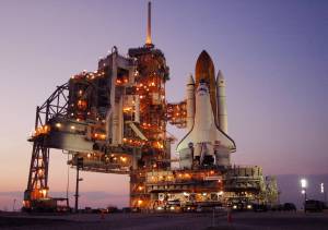 Amid the lights from the fixed and rotating service structures, space shuttle Discovery rests on the hardstand of Launch Pad 39B at NASA's Kennedy Space Center.
