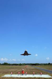 Space shuttle Discovery drops from the blue sky preparing to land on Runway 15 at NASA's Kennedy Space Center. This 69th landing at Kennedy ended the STS-124 mission, a 14-day flight to the International Space Station.