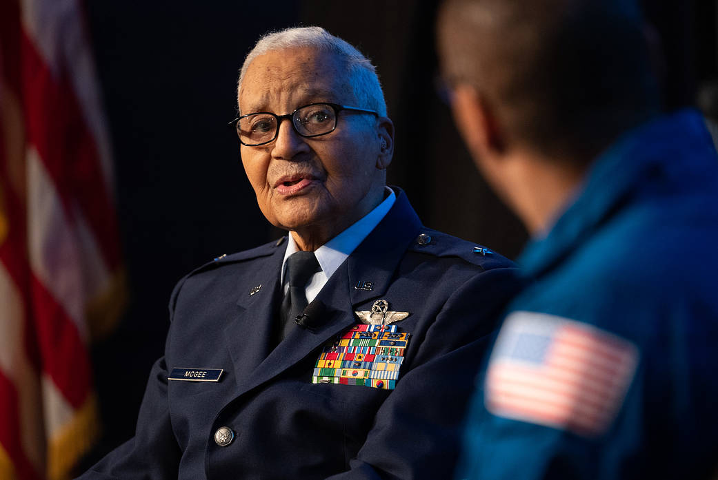 Retired U.S. Air Force Honorary Brigadier General Charles McGee speaks with NASA astronaut Alvin Drew 
