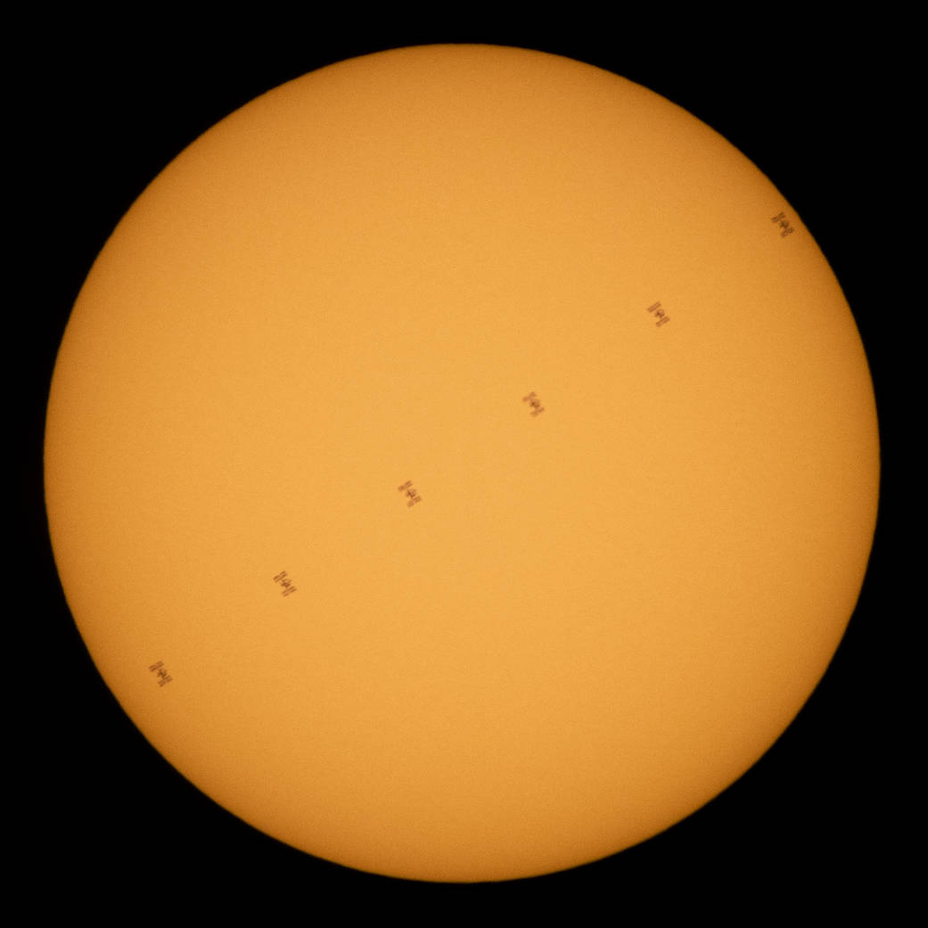 International Space Station in silhouette as it transits the Sun at roughly five miles per second