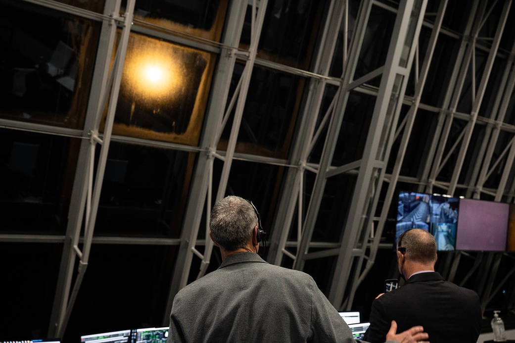 Lee Rosen, VP of Mission and Launch Operations at SpaceX pats Norm Knight, deputy director of Flight Operations at NASA