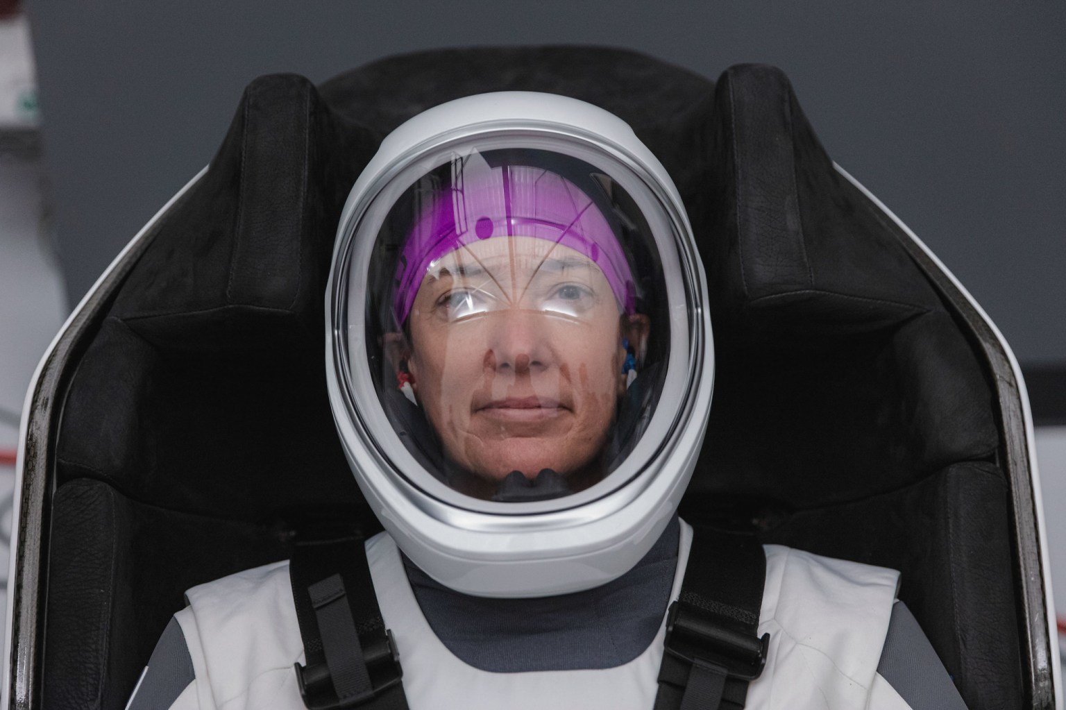  NASA astronaut Megan McArthur, pilot for the SpaceX Crew-2 mission to the International Space Station, is seated inside a mockup of the SpaceX Crew Dragon vehicle during a training session at the SpaceX training facility in Hawthorne,