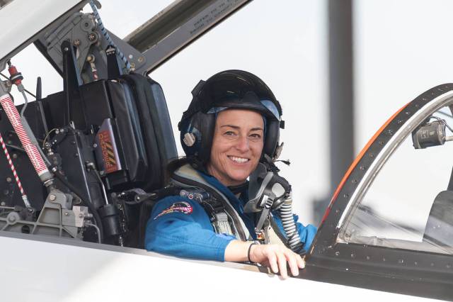 Portrait of NASA astronaut Nicole Mann seated inside a T-38 trainer jet at Ellington Field in Houston, Texas.