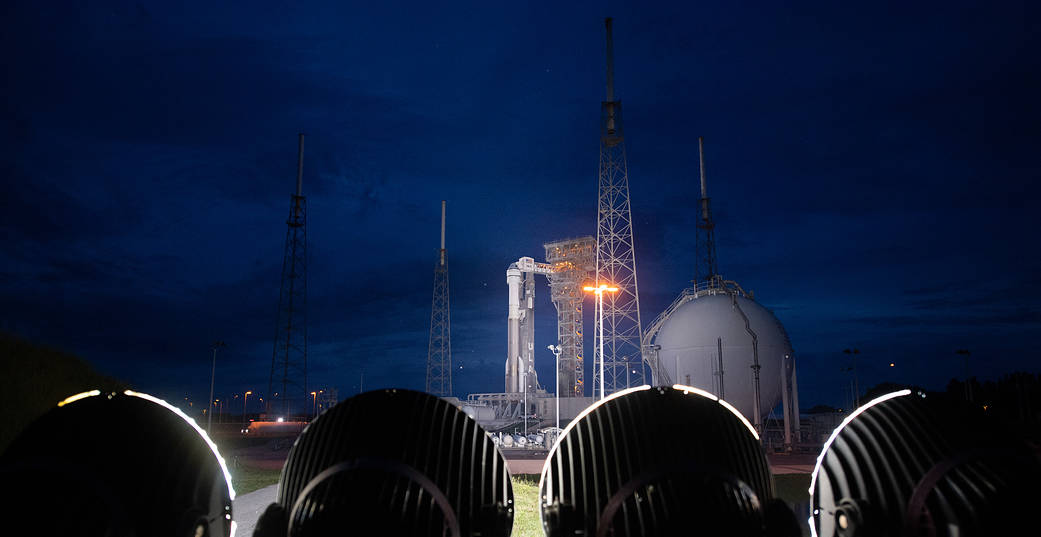 A United Launch Alliance Atlas V rocket with Boeing’s CST-100 Starliner spacecraft aboard is seen illuminated by spotlights on the launch pad at Space Launch Complex 41 
