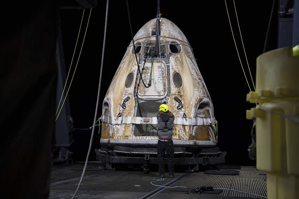 The SpaceX Crew Dragon Endeavour spacecraft is lifted onto the GO Navigator recovery ship after it landed in the Gulf of Mexico off the coast of Pensacola, Florida, Mon., Nov. 8, 2021.