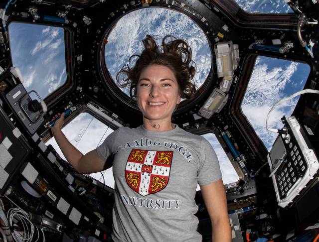Expedition 66 Flight Engineer and NASA astronaut Kayla Barron is pictured inside the seven-windowed cupola, the International Space Station's "window to the world," as the orbital complex flew 263 miles above the Pacific Ocean.