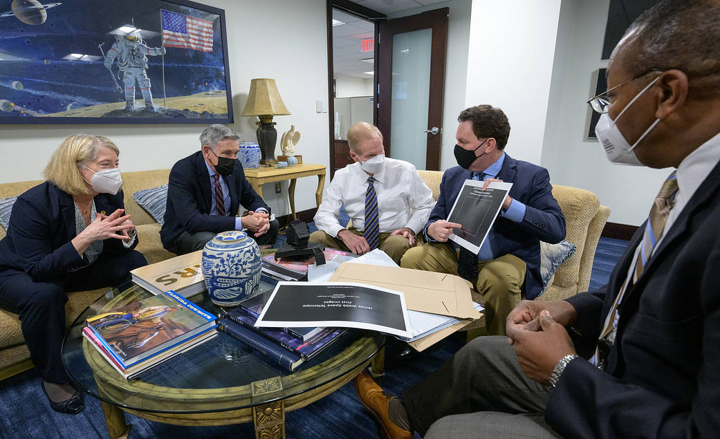 NASA Deputy Administrator Pam Melroy, left, NASA Associate Administrator Bob Cabana, and NASA Administrator Bill Nelson are shown an early mirror alignment image from the James Webb Space Telescope.