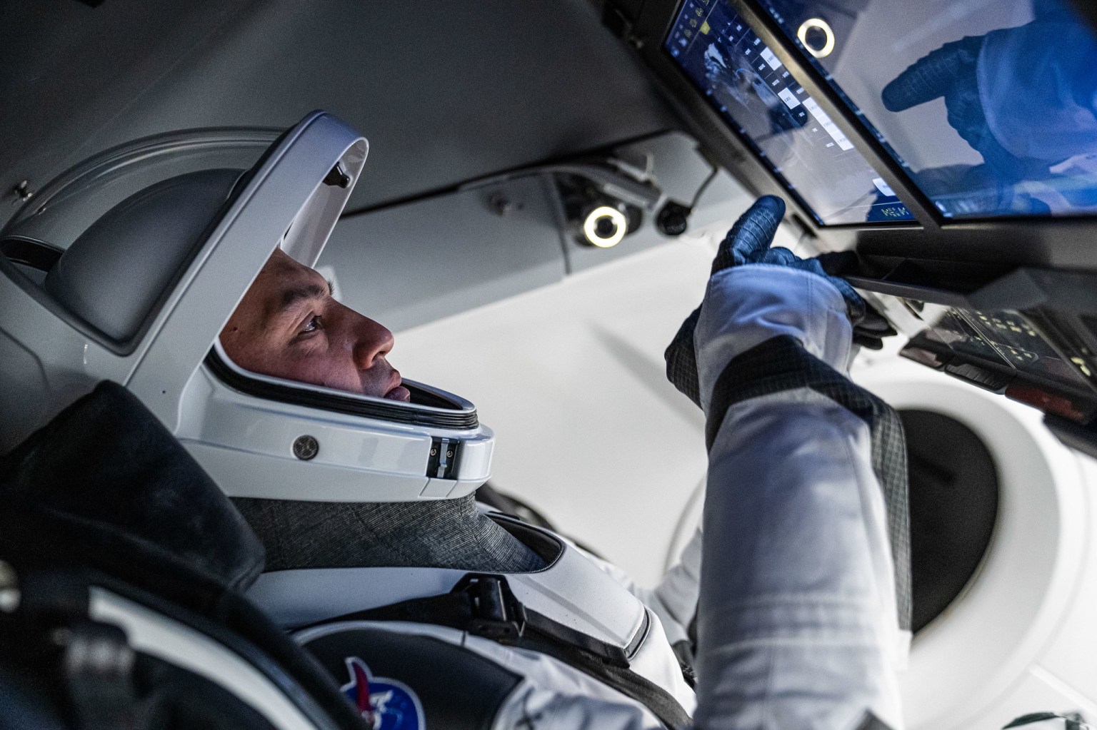 NASA astronaut and SpaceX Crew-4 Commander Kjell Lindgren, representing NASA's Commercial Crew Program, is pictured during a training session inside a mockup of the Crew Dragon vehicle at SpaceX Headquarters in Hawthorne, California.
