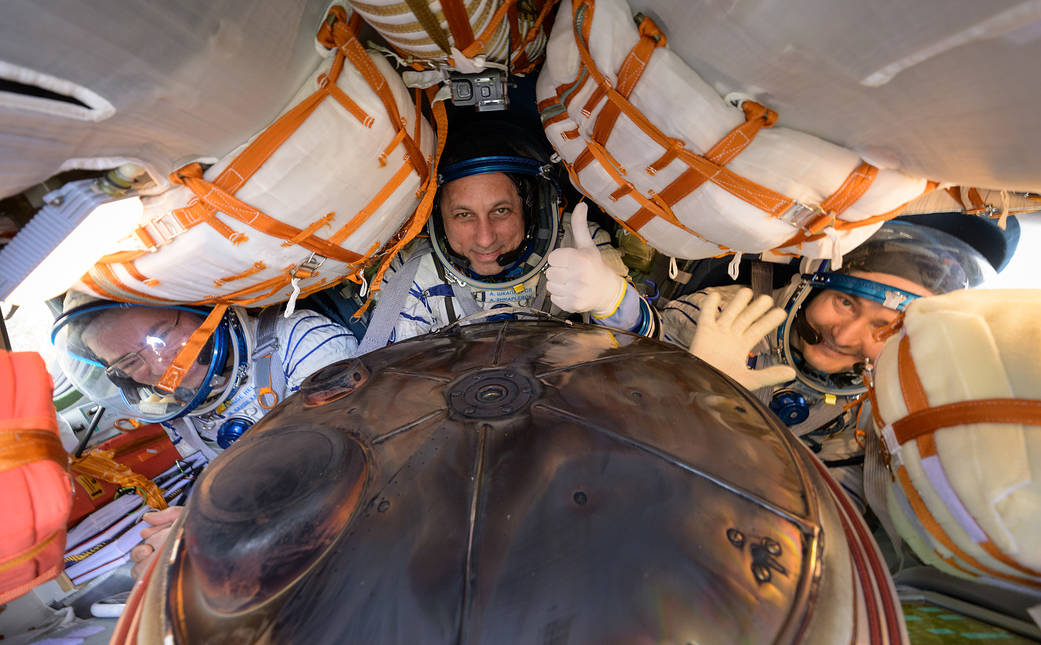 Expedition 66 crew members Mark Vande Hei of NASA, left, cosmonauts Anton Shkaplerov, center, and Pyotr Dubrov of Roscosmos, are seen inside their Soyuz MS-19 spacecraft after is landed in a remote area near the town of Zhezkazgan, Kazakhstan
