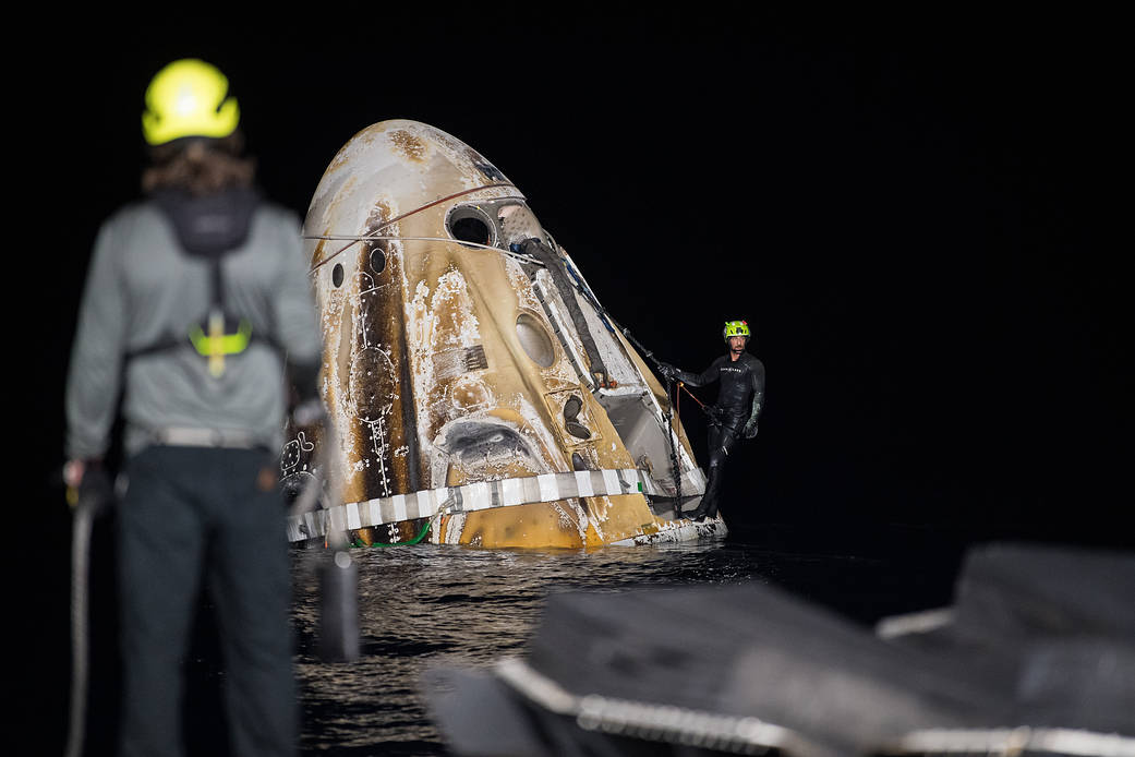 Support teams work around the SpaceX Crew Dragon Endurance spacecraft shortly after it landed with NASA astronauts Raja Chari, Kayla Barron, Tom Marshburn, and ESA (European Space Agency) astronaut Matthias Maurer aboard, Friday, May 6, 2022.