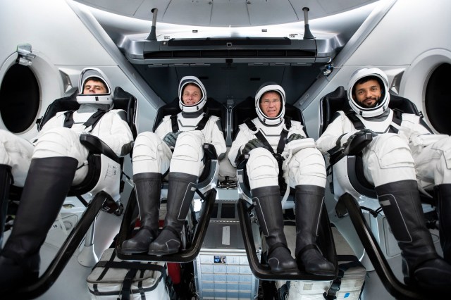 The four crew members that comprise the SpaceX Crew-6 mission are seated inside the SpaceX Dragon crew ship during a training session at the company's headquarters in Hawthorne, California. Seated from left in their spacesuits are, Mission Specialist Andrey Fedyaev, Pilot Warren "Woody" Hoburg, Commander Stephen Bowen, and Mission Specialist Sultan Alneyadi. Credit: SpaceX