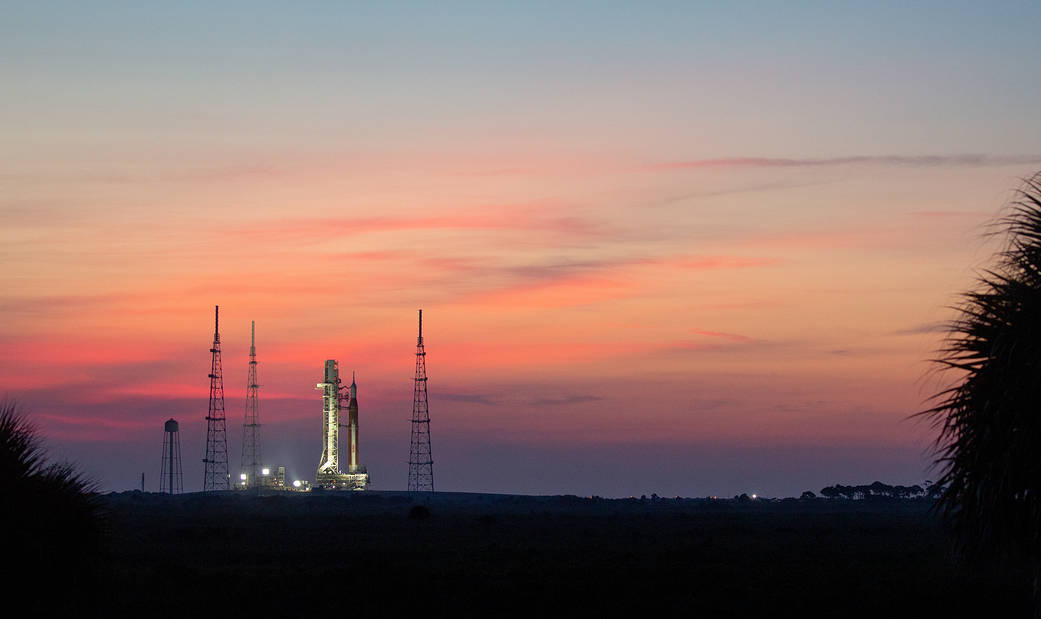 NASA’s Space Launch System (SLS) rocket with the Orion spacecraft aboard is seen at sunrise atop the mobile launcher as it arrives at Launch Pad 39B, Wednesday, Aug. 17, 2022, at NASA’s Kennedy Space Center in Florida. 