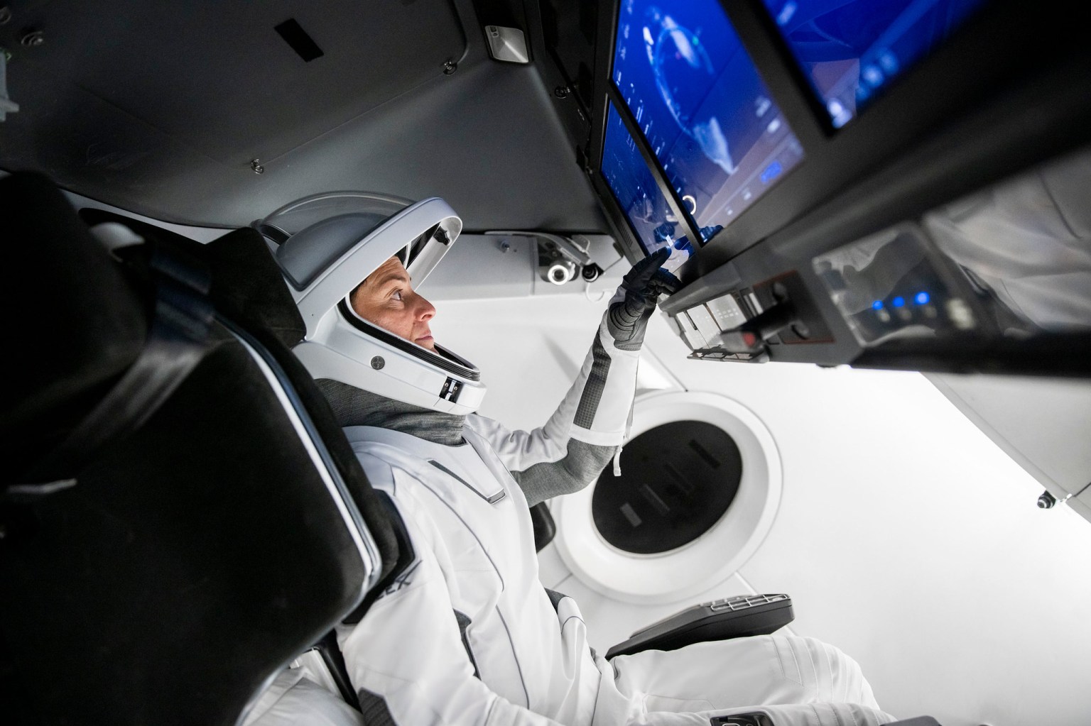 SpaceX Crew-5 Commander Nicole Aunapu Mann from NASA is pictured during a Crew Dragon cockpit training session at SpaceX headquarters in Hawthorne