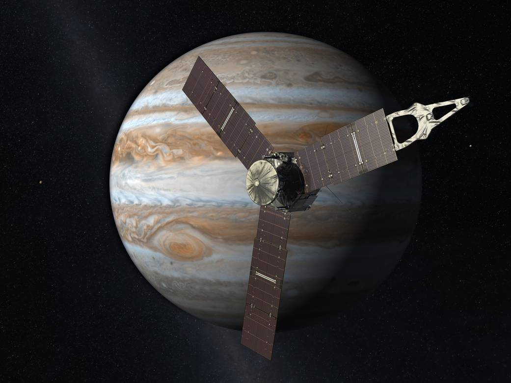 Artist concept of Juno spacecraft in space in front of Jupiter