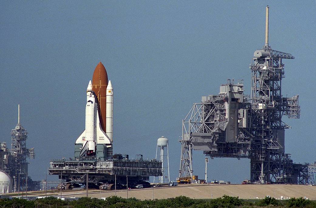 The space shuttle Endeavour rolls from Launch Pad 39A to Launch Pad 39B. The rare pad switch was deemed necessary after contamination was discovered in the payload changeout room at Pad A. 