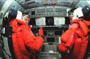 STS-88 Mission Commander Robert D. Cabana (left) and Pilot Frederick W. "Rick" Sturckow (right) take their seats in the flight deck inside space shuttle Endeavour during Terminal Countdown Demonstration Activities.