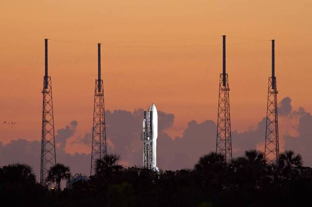 As the sun comes up over Cape Canaveral Air Force Station in Florida, preparations are under way to launch the United Launch Alliance Atlas V-551 carrying NASA's Juno spacecraft.