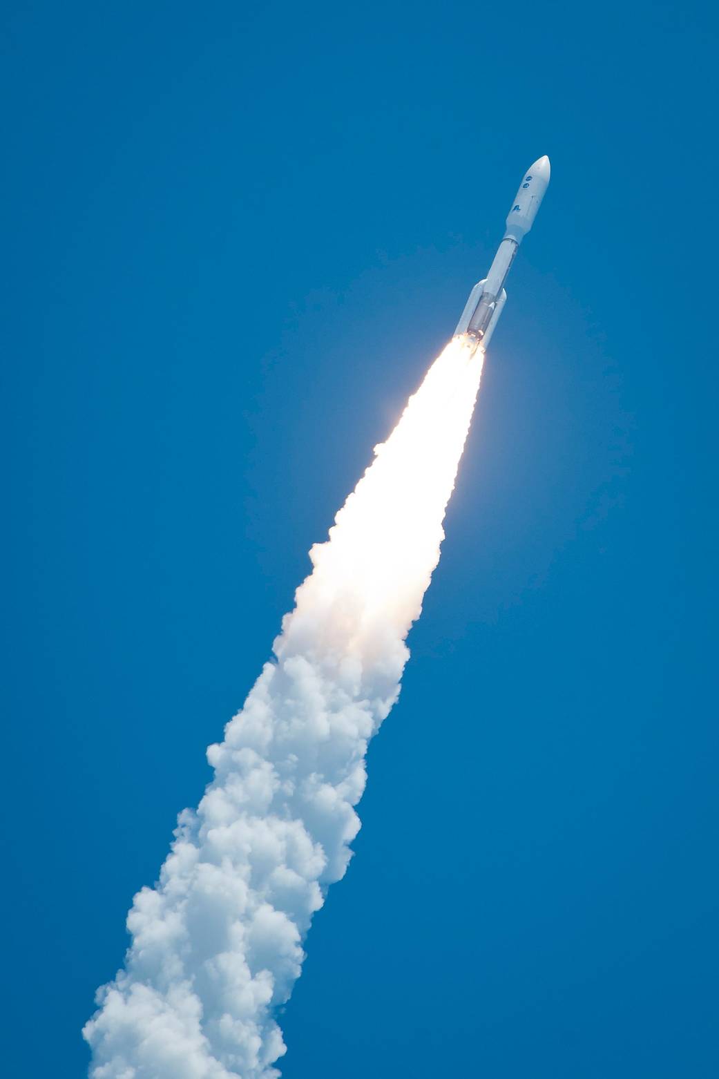 The Juno spacecraft, safely enclosed in the payload fairing at the top of an Atlas V rocket, begins its journey to Jupiter with a spectacular midday launch.