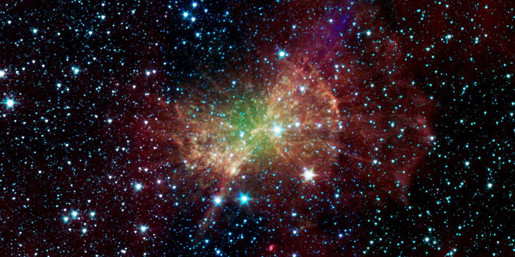 The Dumbbell nebula, also known as Messier 27, pumps out infrared light in this image from NASA Spitzer Space Telescope.