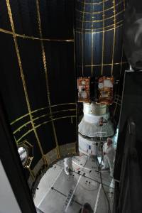 The second half of the clamshell-shaped Delta payload fairing swings into place around NASA's twin Gravity Recovery and Interior Laboratory spacecraft.