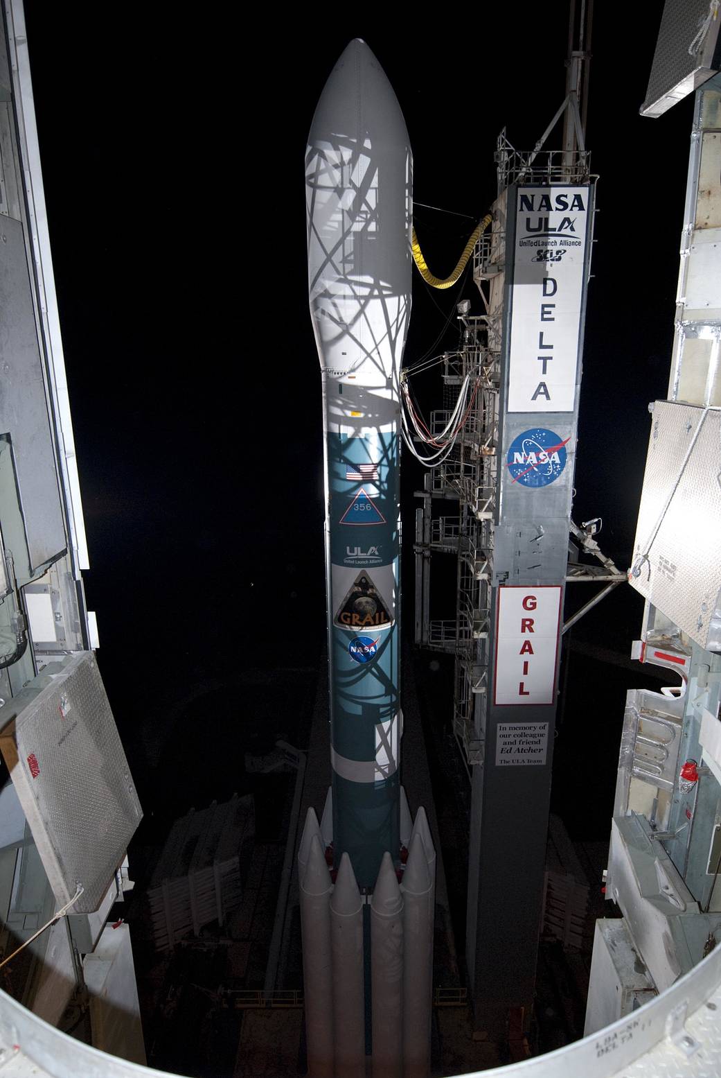 During mobile service tower rollback activities, spotlights at Space Launch Complex 17B create a mesh of shadows across the Delta II rocket set to carry NASA's twin GRAIL spacecraft.