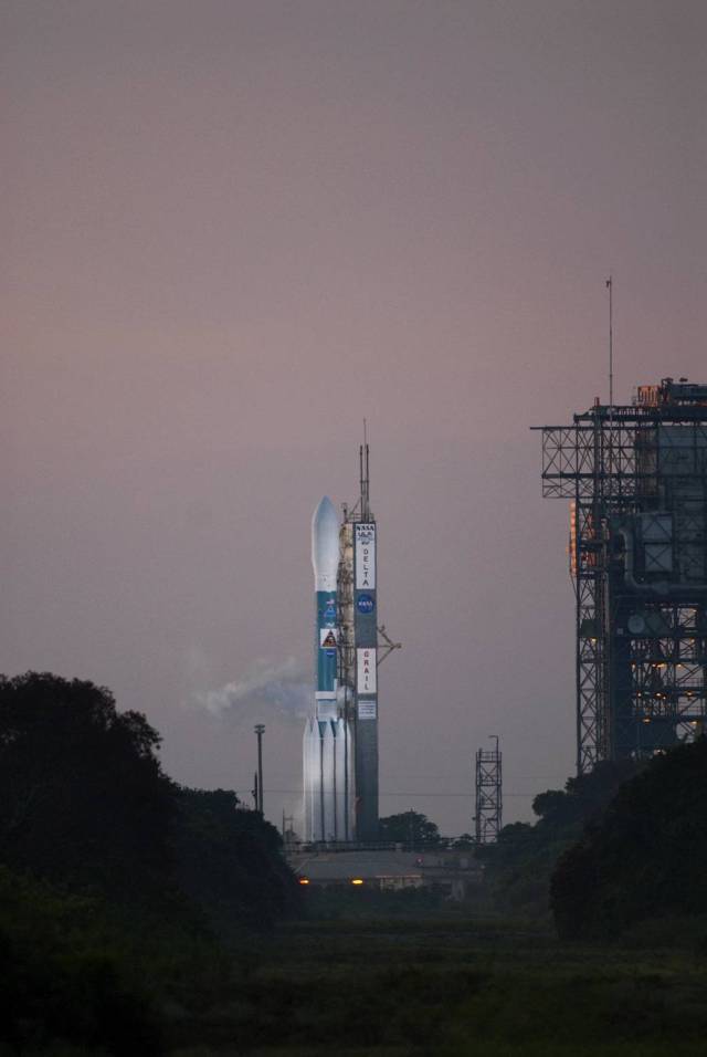 Surrounded by an early morning sky, the United Launch Alliance Delta II Heavy rocket sits on Space Launch Complex 17B on Cape Canaveral Air Force Station in Florida. 