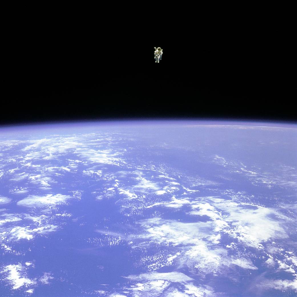 Astronaut Bruce McCandless floats in space using a jetpack