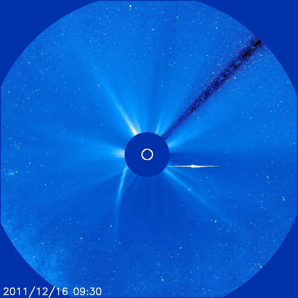 SOHO's view the morning of Dec. 16, 2011 shows the comet head emerging from the right side of the sun.
