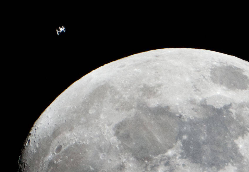 Space Station Flying by the Moon